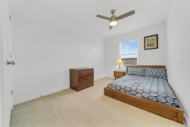 bedroom featuring ceiling fan and light colored carpet