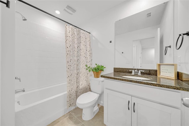 full bathroom with toilet, vanity, tile patterned flooring, and shower / tub combo