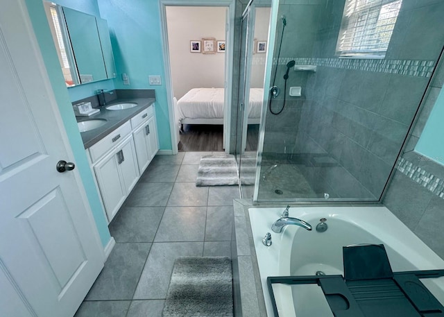 bathroom with vanity, tile patterned floors, and plus walk in shower