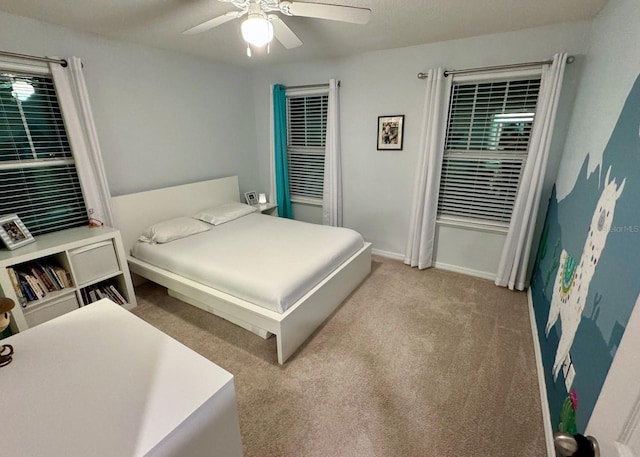 bedroom featuring ceiling fan and light colored carpet