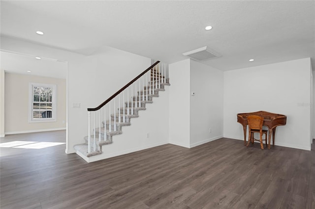 interior space with dark hardwood / wood-style flooring and a textured ceiling