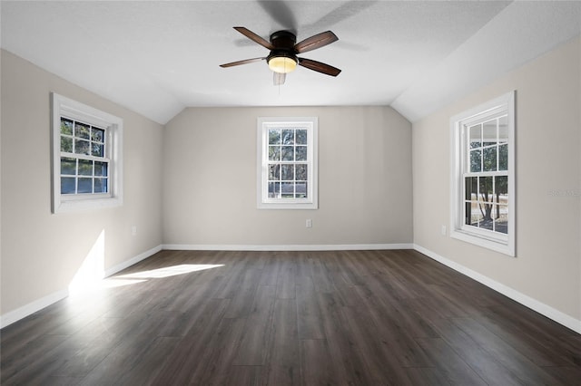 bonus room featuring dark hardwood / wood-style flooring, vaulted ceiling, and a textured ceiling