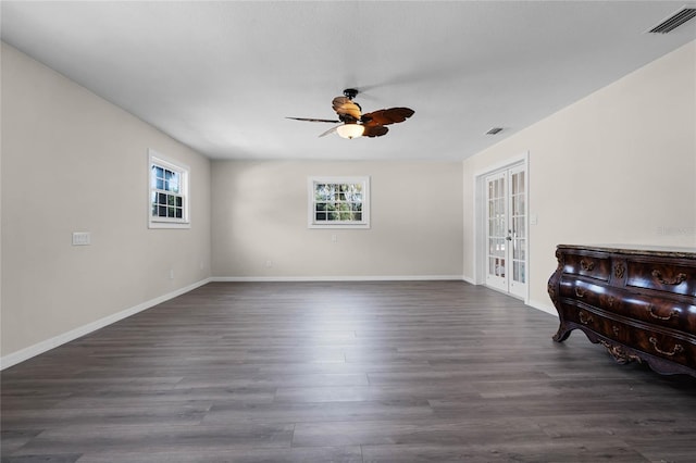 interior space with dark wood-type flooring, ceiling fan, and french doors