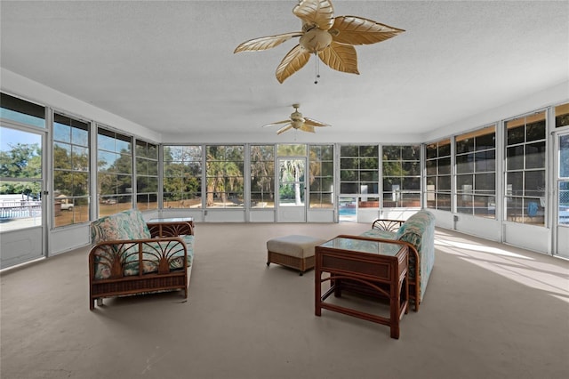 sunroom featuring ceiling fan