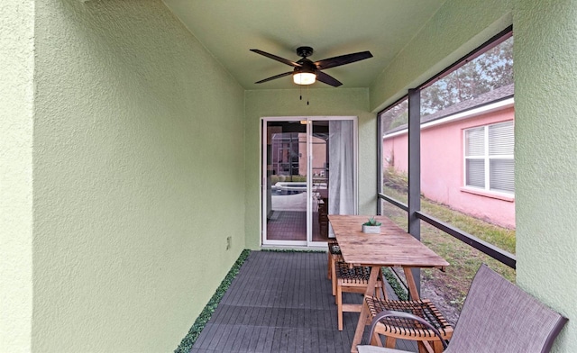 sunroom with ceiling fan