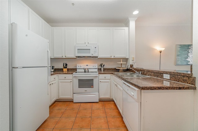 kitchen with sink, white appliances, white cabinetry, ornamental molding, and kitchen peninsula