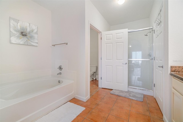 full bathroom featuring vanity, tile patterned flooring, independent shower and bath, and toilet