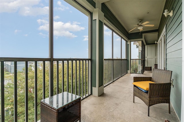 sunroom / solarium featuring a wealth of natural light and ceiling fan