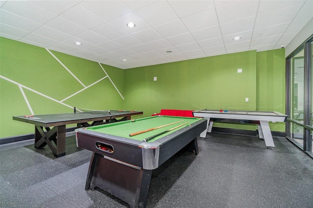 game room with a drop ceiling