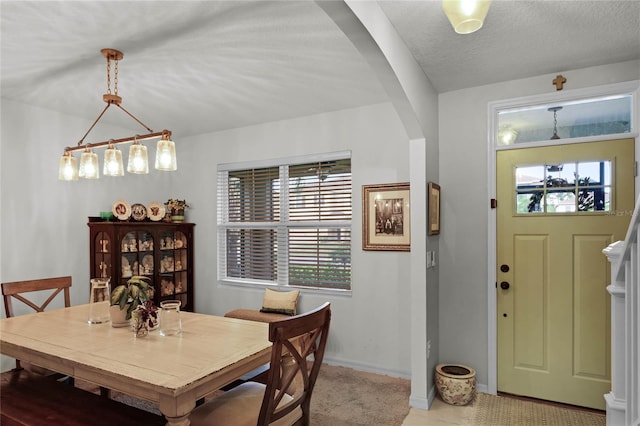 dining room with a textured ceiling