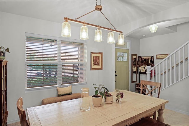 dining room with a healthy amount of sunlight and light tile patterned floors