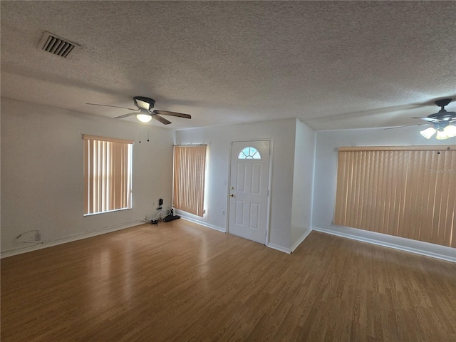 entryway featuring a textured ceiling, ceiling fan, and hardwood / wood-style flooring