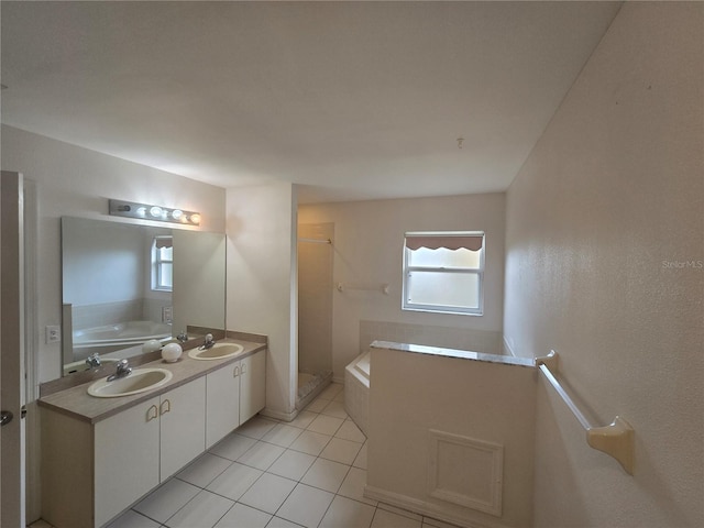 bathroom with plus walk in shower, tile patterned flooring, and vanity