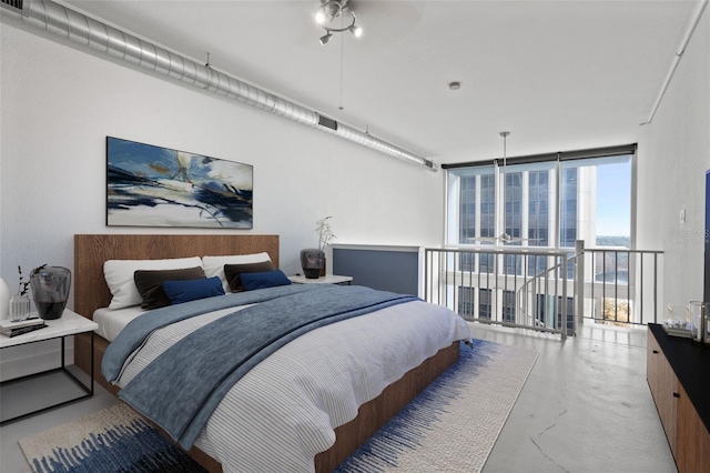 bedroom featuring expansive windows