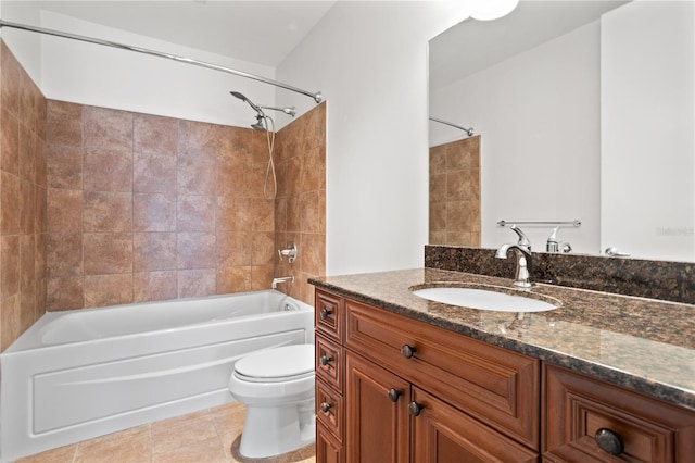 full bathroom with toilet, vanity, tile patterned floors, and tiled shower / bath