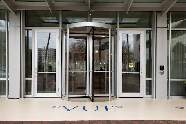 view of exterior entry featuring a patio