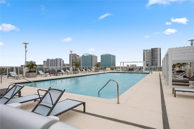 view of swimming pool with a patio area