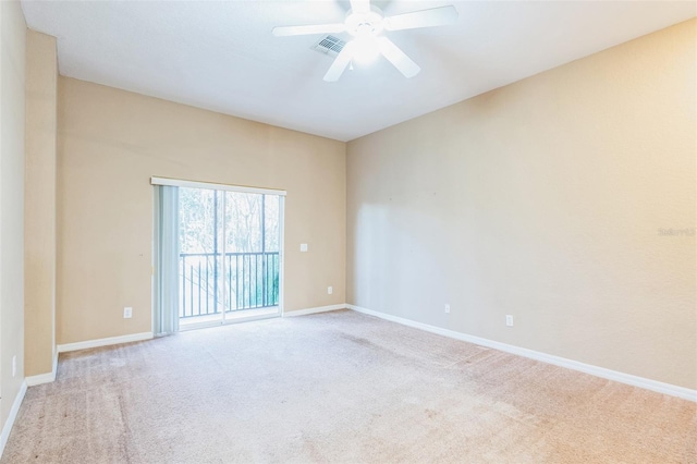 carpeted empty room with ceiling fan