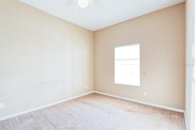 empty room with light carpet and ceiling fan