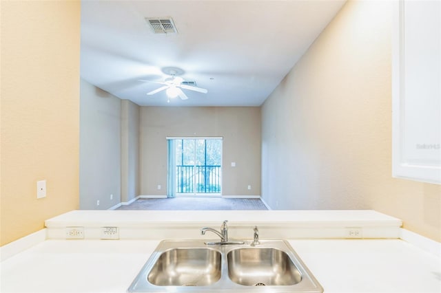 kitchen with ceiling fan and sink