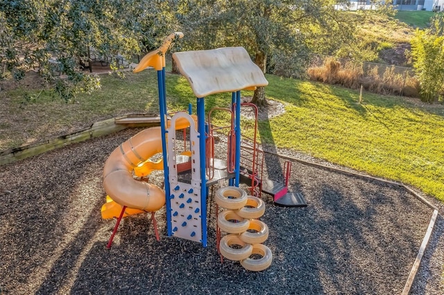 view of playground with a lawn