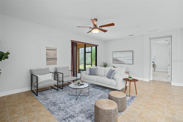 tiled living room featuring ceiling fan