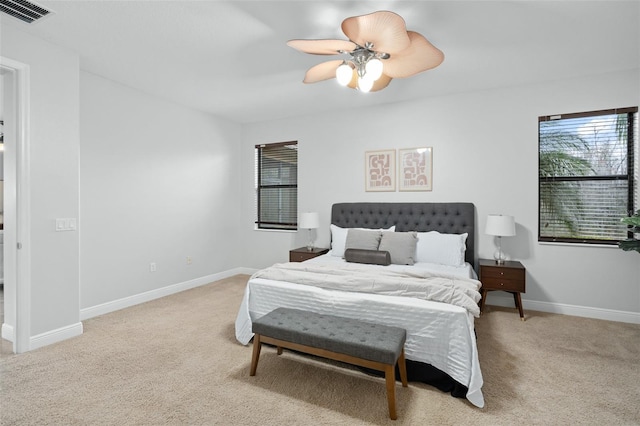 bedroom featuring ceiling fan and light colored carpet