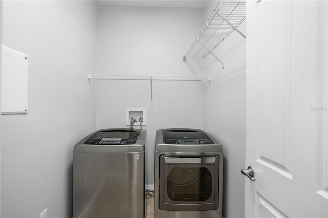 washroom with washer and clothes dryer