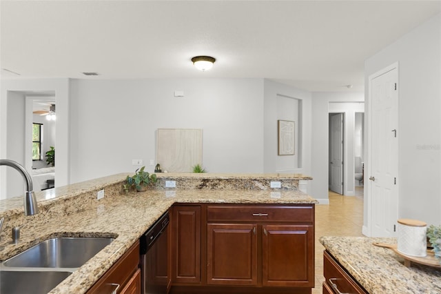 800 Ebb Tide Ln, Kissimmee, FL 34759 - kitchen with dishwashing machine, a sink, light stone counters, and visible vents