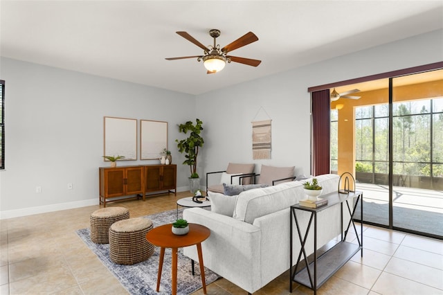 800 Ebb Tide Ln, Kissimmee, FL 34759 - living room with a ceiling fan, light tile patterned floors, and baseboards