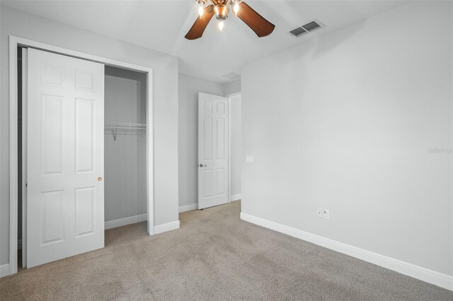 800 Ebb Tide Ln, Kissimmee, FL 34759 - unfurnished bedroom with a closet, carpet flooring, baseboards, visible vents, and ceiling fan