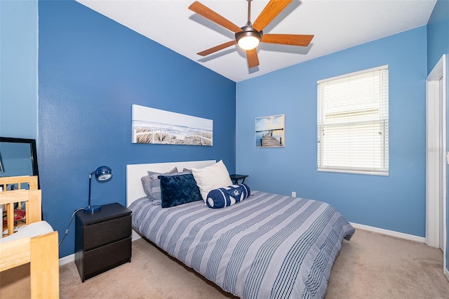 carpeted bedroom featuring ceiling fan