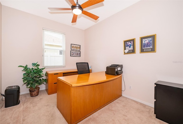 office space with ceiling fan and light carpet