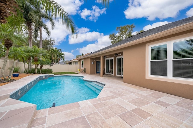 view of swimming pool featuring a patio area