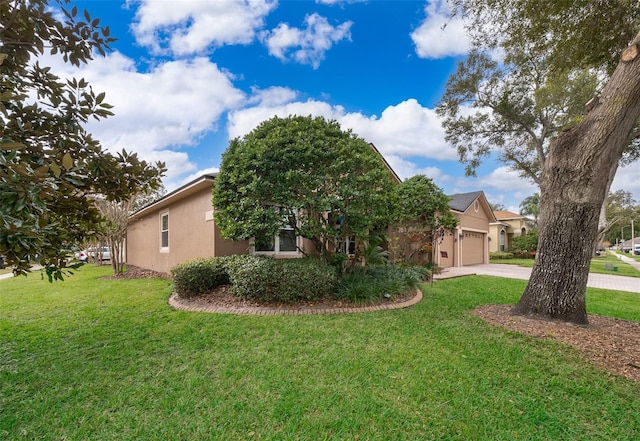 view of front of property featuring a garage and a front yard