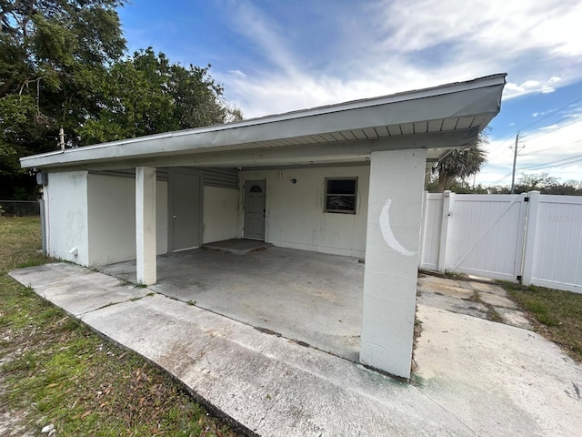 exterior space featuring a carport