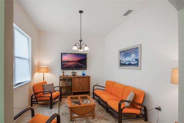 living area featuring a chandelier