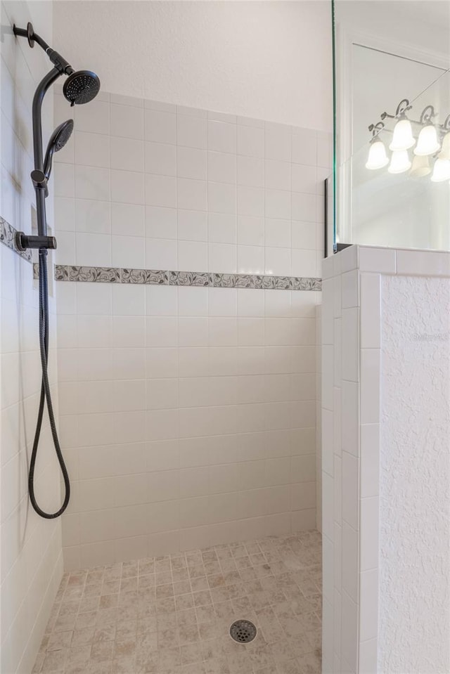 bathroom with tiled shower