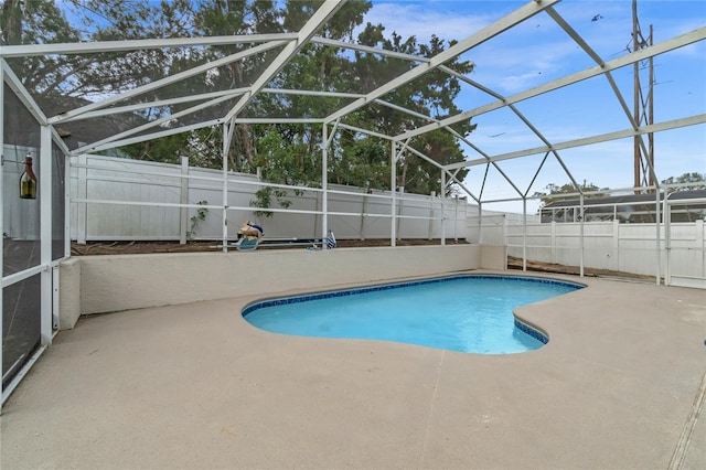 view of pool with a lanai and a patio