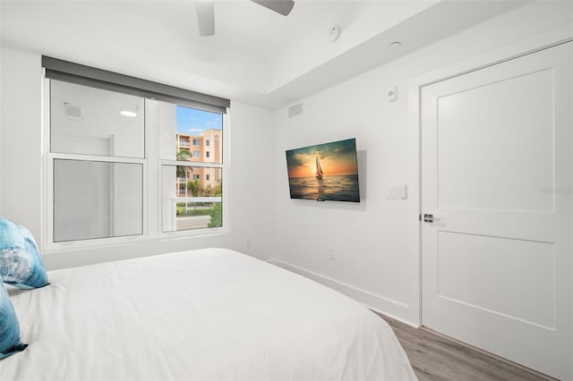 bedroom featuring ceiling fan and hardwood / wood-style floors