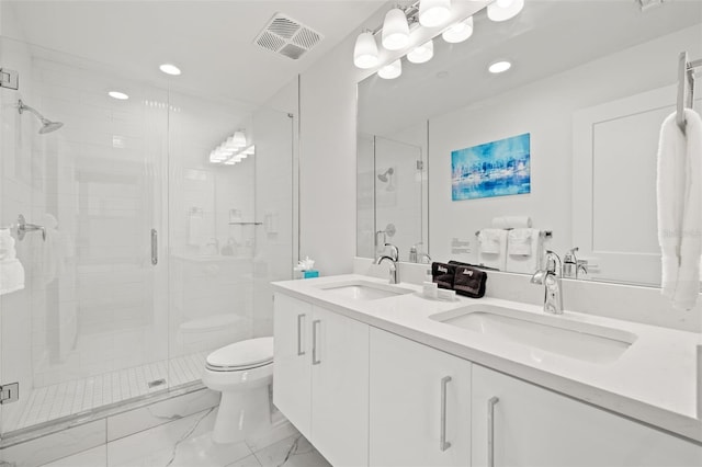 bathroom featuring toilet, vanity, and walk in shower