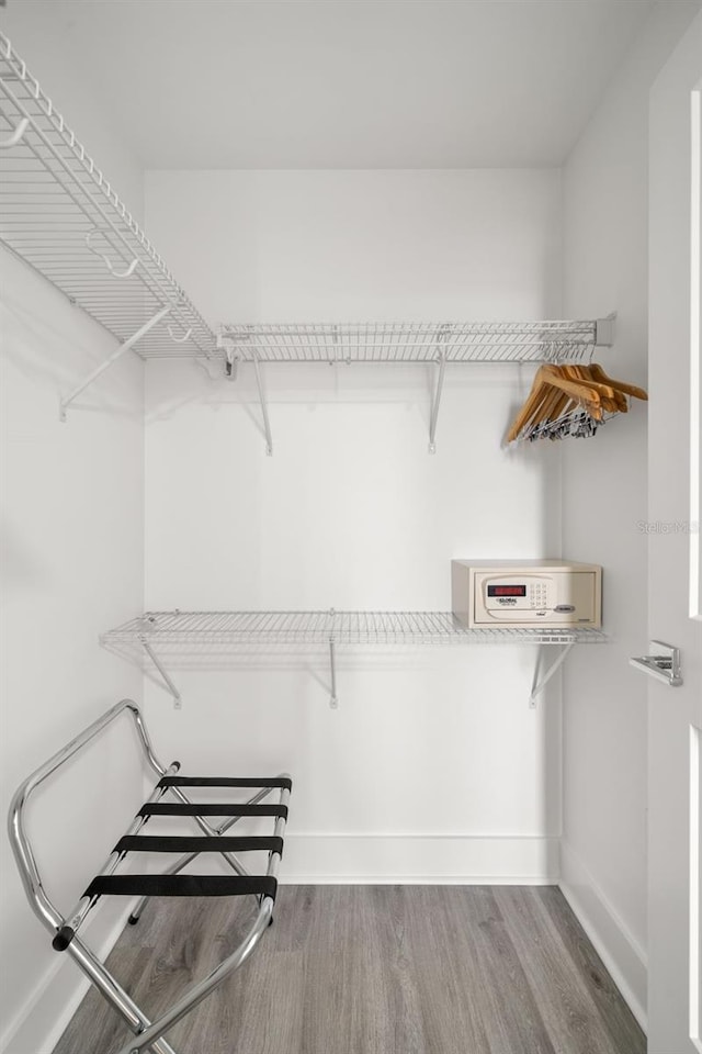 walk in closet featuring hardwood / wood-style flooring