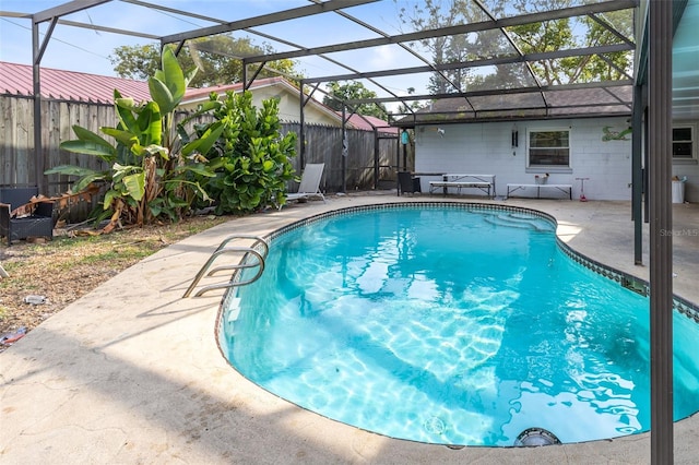 view of pool featuring a lanai and a patio area