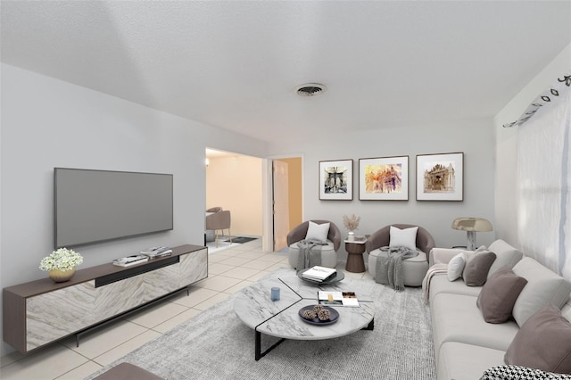 living room with light tile patterned floors and a textured ceiling