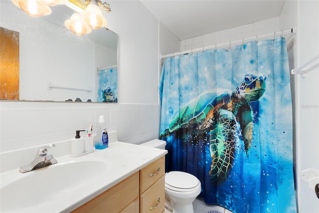 bathroom featuring toilet, a shower with shower curtain, tile walls, and vanity