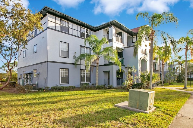 exterior space with a front lawn and central air condition unit