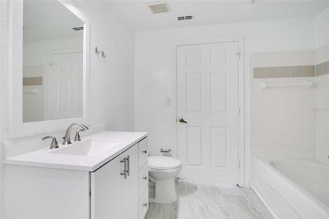 bathroom featuring toilet and vanity