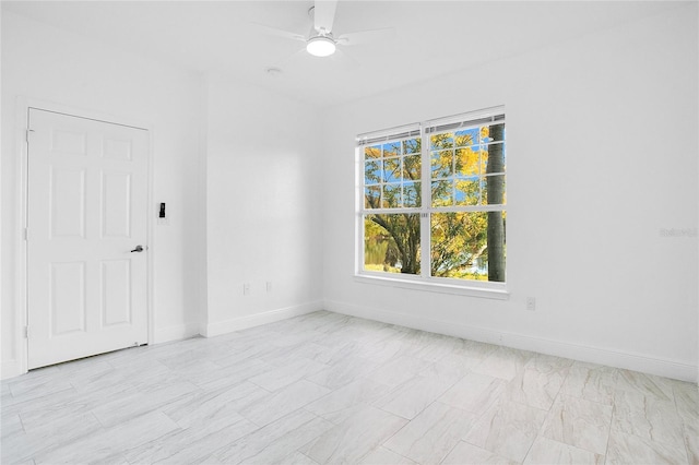 unfurnished room with ceiling fan