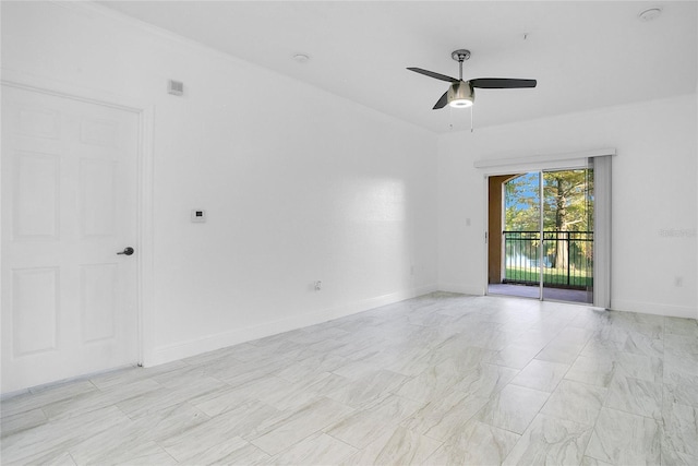 unfurnished room featuring ceiling fan and ornamental molding