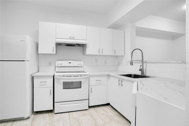 kitchen with sink, white appliances, and white cabinetry